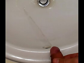 Pissing in guest-house bathroom borehole